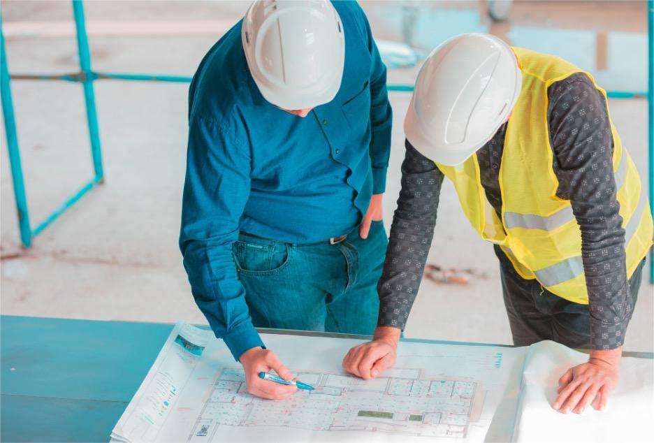 construction workers planning blueprint
